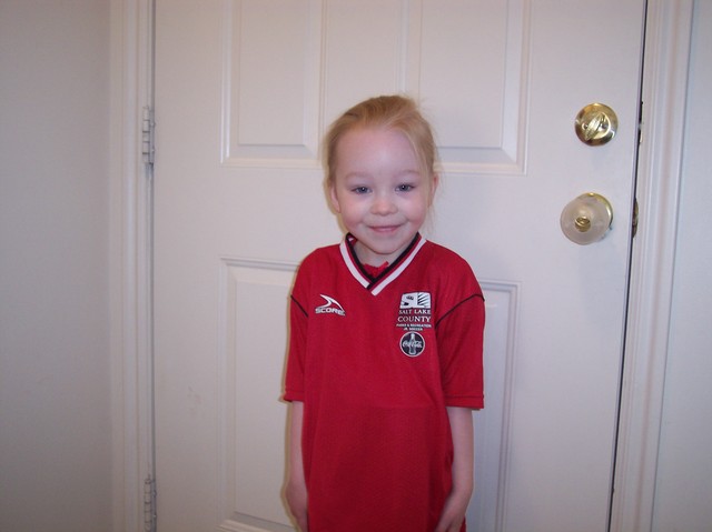 Emma in her soccer uniform