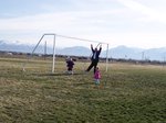 Emma, Sarah, and Dad playing soccer