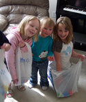 Emma, Emily, and Andrea looking for eggs