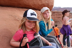 Emma and Sarah next to Delicate Arch