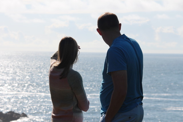 Jillian and Mike looking out from Ecola State Park