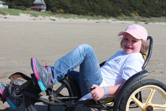 Sarah fun-cycling on Manzanita Beach