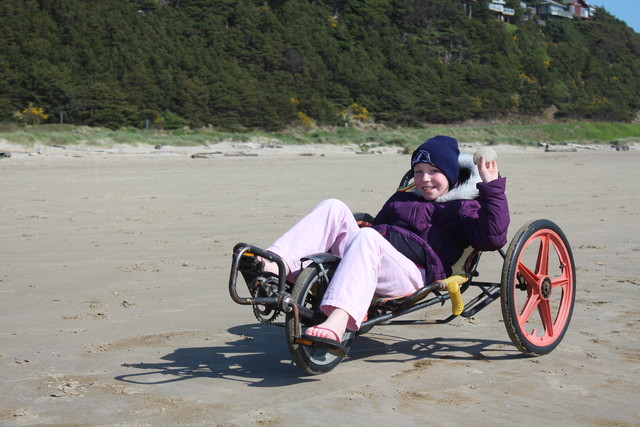 Emma fun-cycling on Manzanita Beach