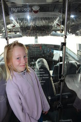 Emma in front of the old Air Force One cockpit