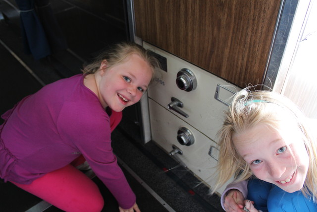 Sarah and Emma in front of the safes on board Air Force One where the nuclear football was stored