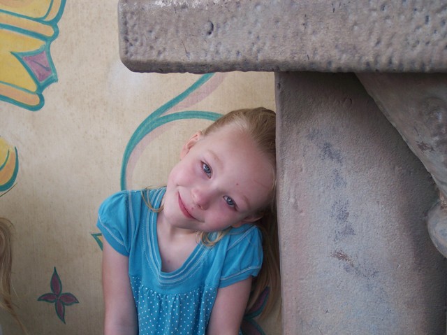 Emma waiting to meet the princesses at Disneyland