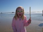 Emma at Huntington Beach - Look, I found a stick of bamboo!!!