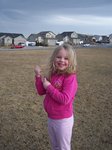 Sarah flying a kite in the park