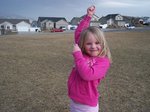 Sarah flying a kite in the park