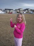 Sarah flying a kite in the park