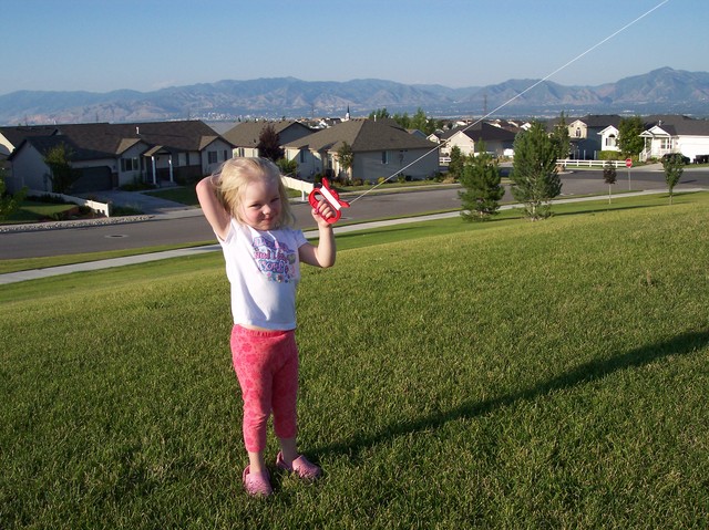 Sarah flying kite at park