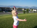 Sarah flying kite at park