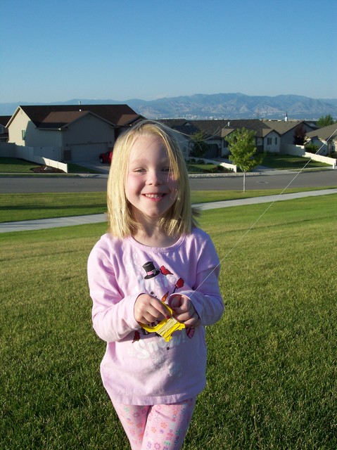 Emma flying kite at park