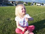 Sarah flying kite at park