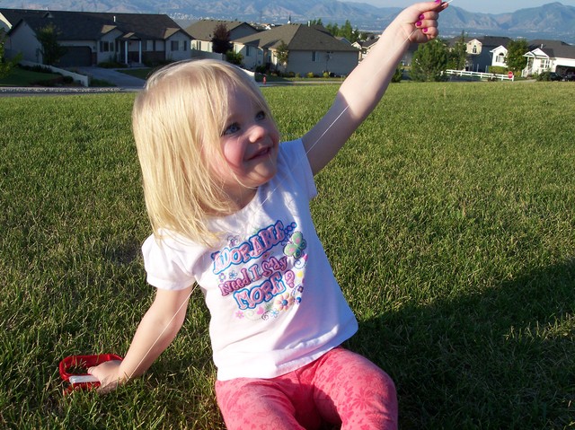 Sarah flying kite at park