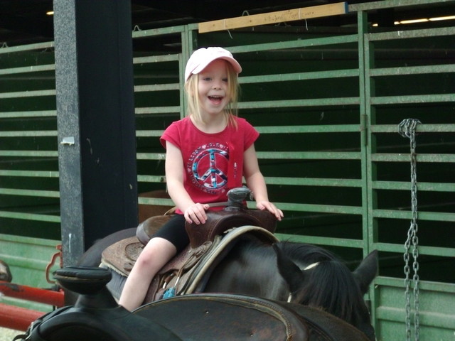 Emma riding pony at County Fair