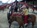 Sarah riding pony at County Fair