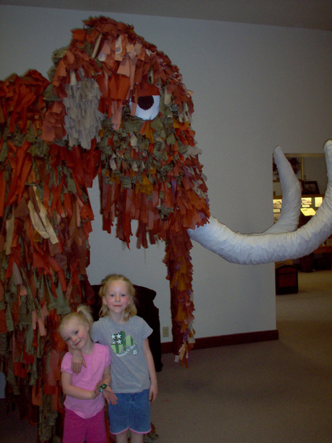 Emma and Sarah by a Mammoth at a museum