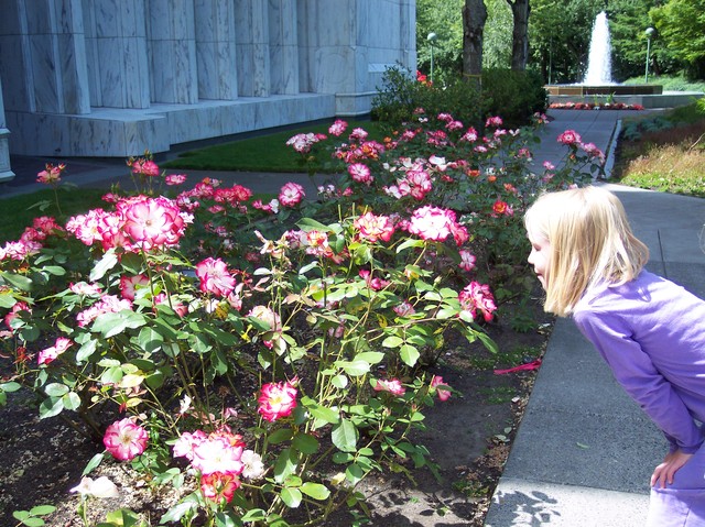 Emma stopping to smell the flowers at the Portland Temple