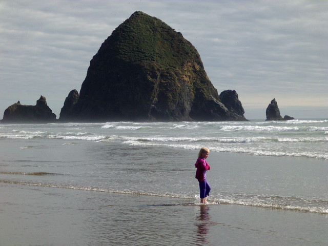 Emma wading by Haystack Rock