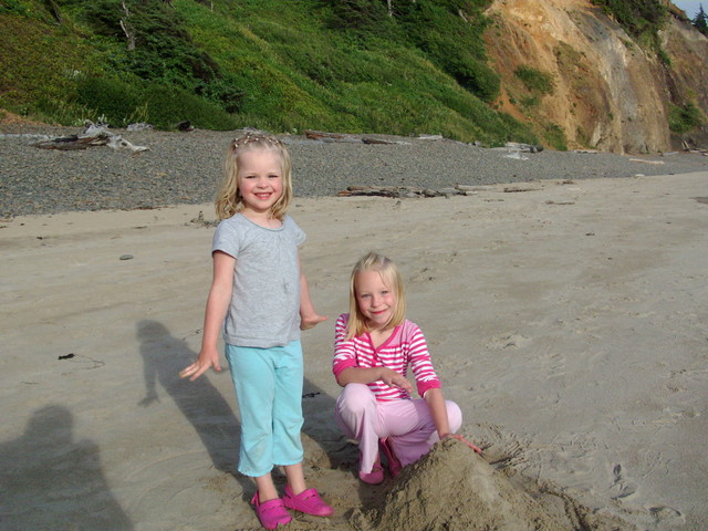 Sarah and Emma making a sandcastle