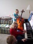 Emma, Andrea, and Nathan giving a concert