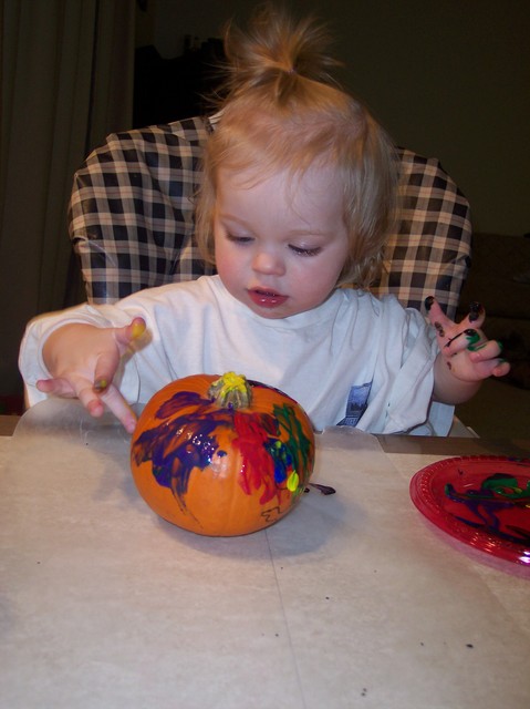 Sarah painting pumpkins