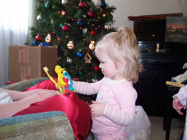 Sarah on Christmas morning - her favorite toy that year :)