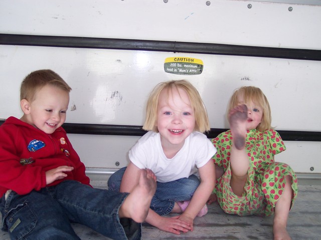 Sarah, Nathan and Emma playing in the back of a U-Haul