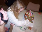 Emma building a gingerbread house on Emma's 6th Birthday
