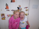 Emma and Sarah showing off their hair and halloween decorations