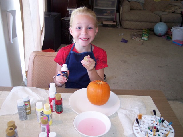 Emma Painting Her Pumpkin